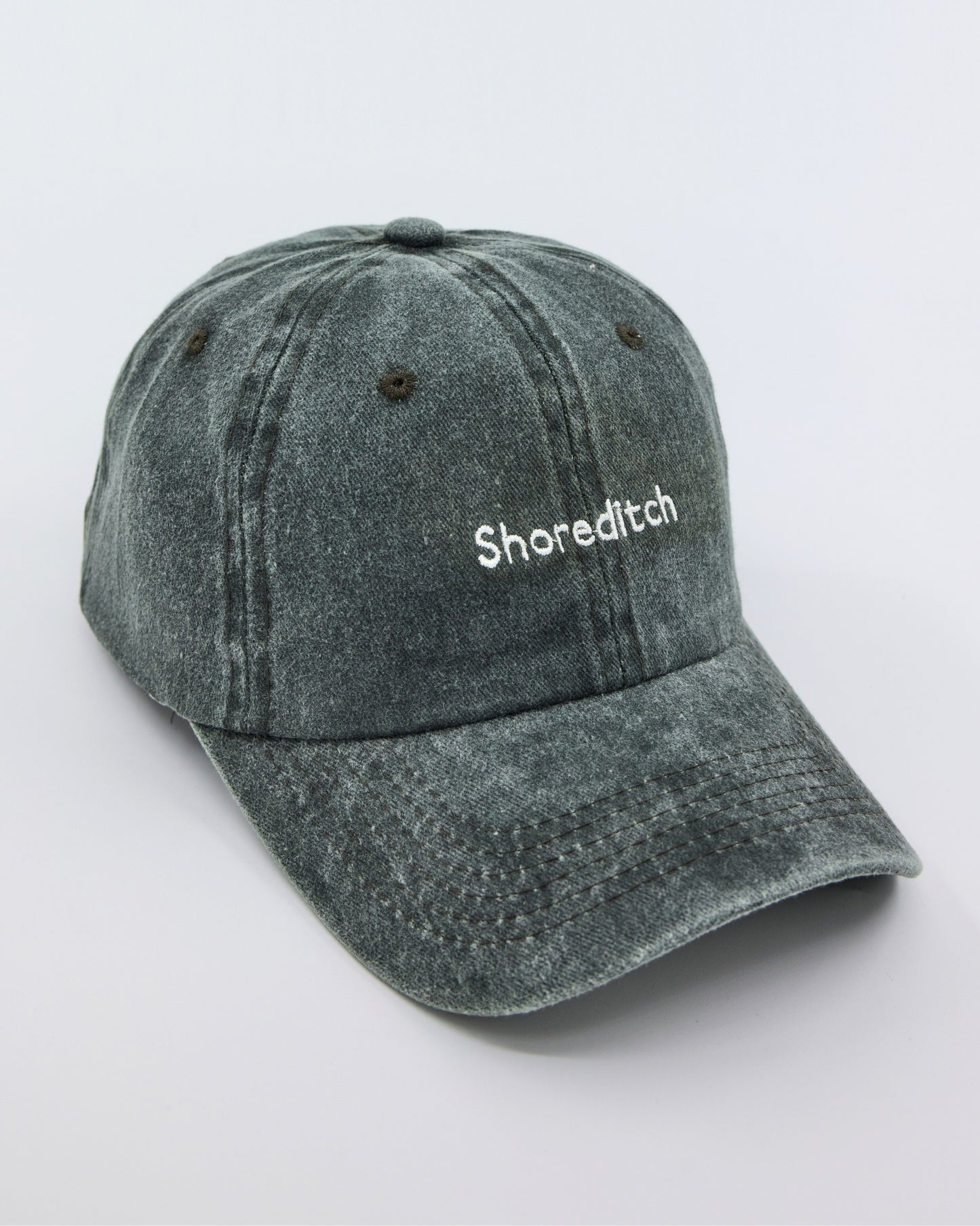 side view of Shoreditch Dark Green Washed Cap