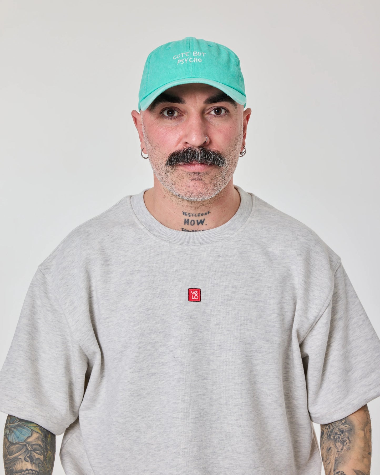 man wearing Cute But Psycho Aqua Blue Washed Caps