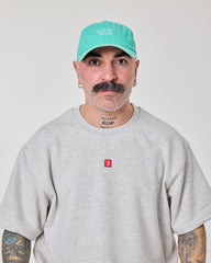 man wearing Cute But Psycho Aqua Blue Washed Caps