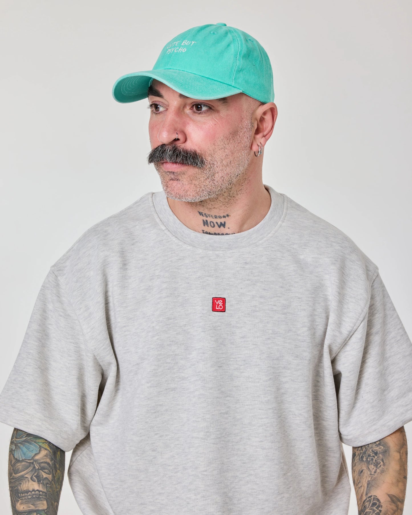 man wearing Cute But Psycho Aqua Blue Washed Cap Hat