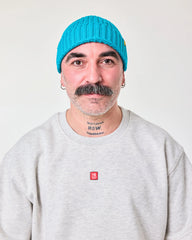 front view of a man wearing Aqua Blue Fisherman Beanie