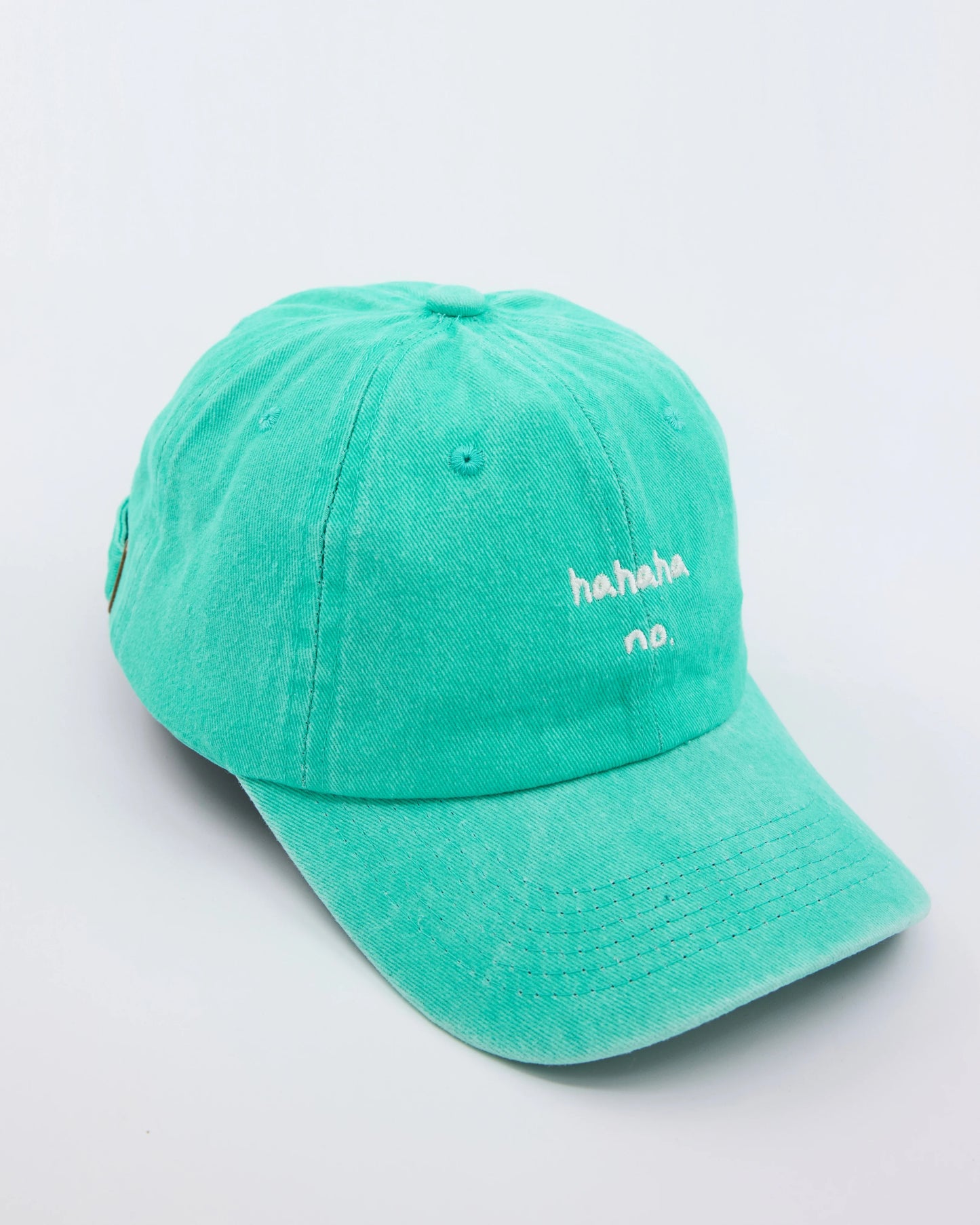 side view of Hahaha No Aqua Blue Washed Cap
