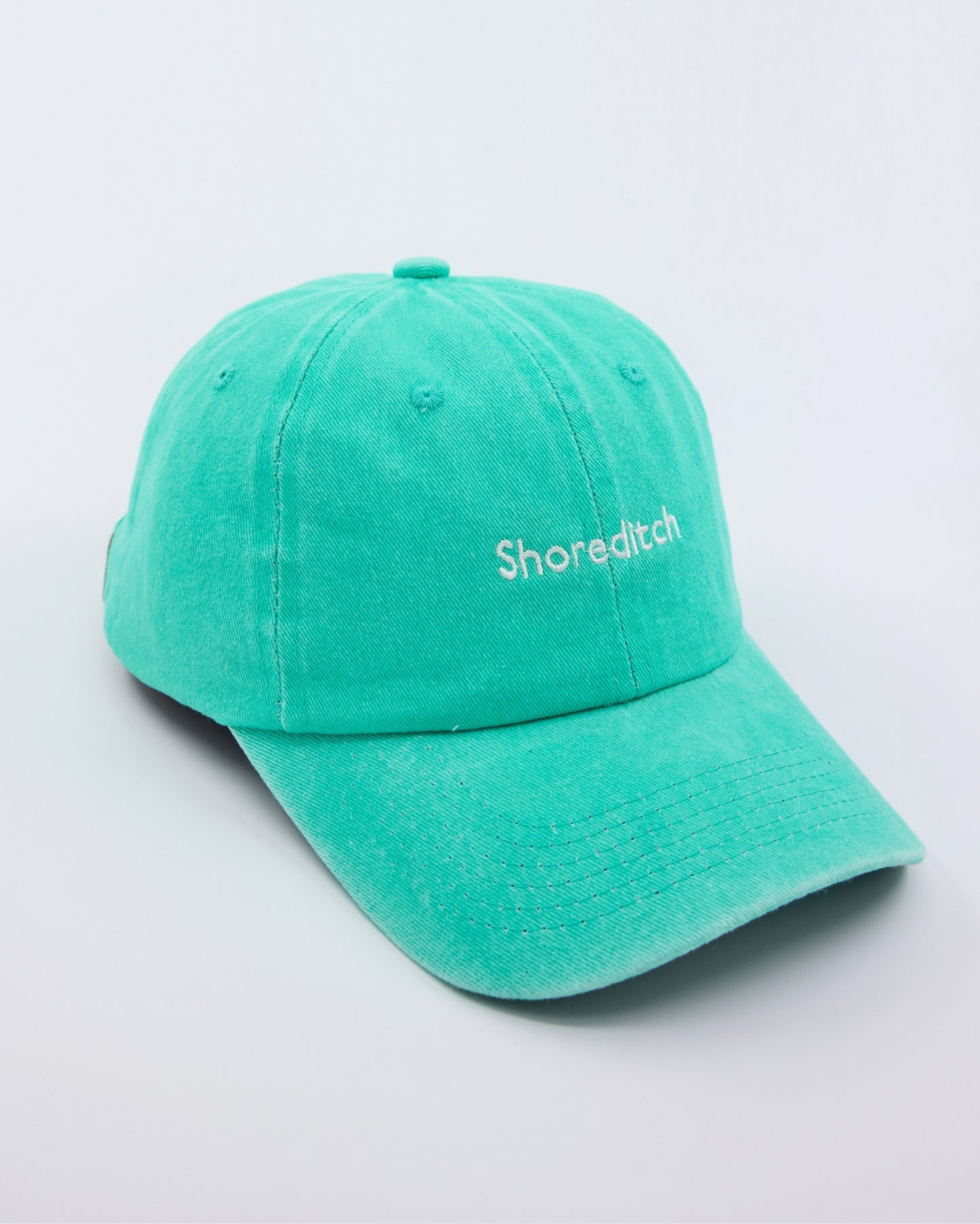 side view of Shoreditch Aqua Blue Washed Cap
