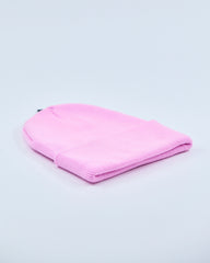 Baby pink beanie on a light gray background