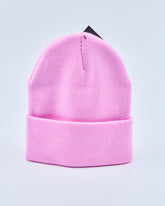 Baby pink beanie on a light gray background