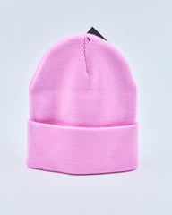 Baby pink beanie on a light gray background