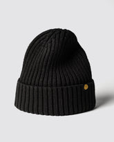 Black Classic Beanie with a gold logo on a light gray background