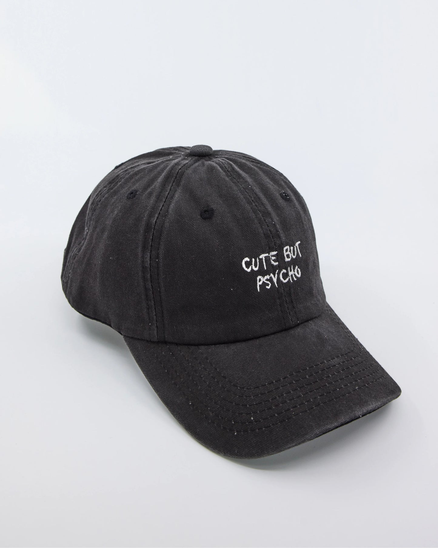 side view of Cute But Psycho Black Washed Cap