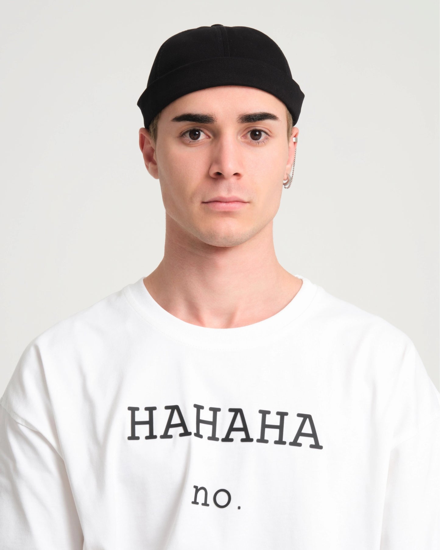man wearing a black docker cap