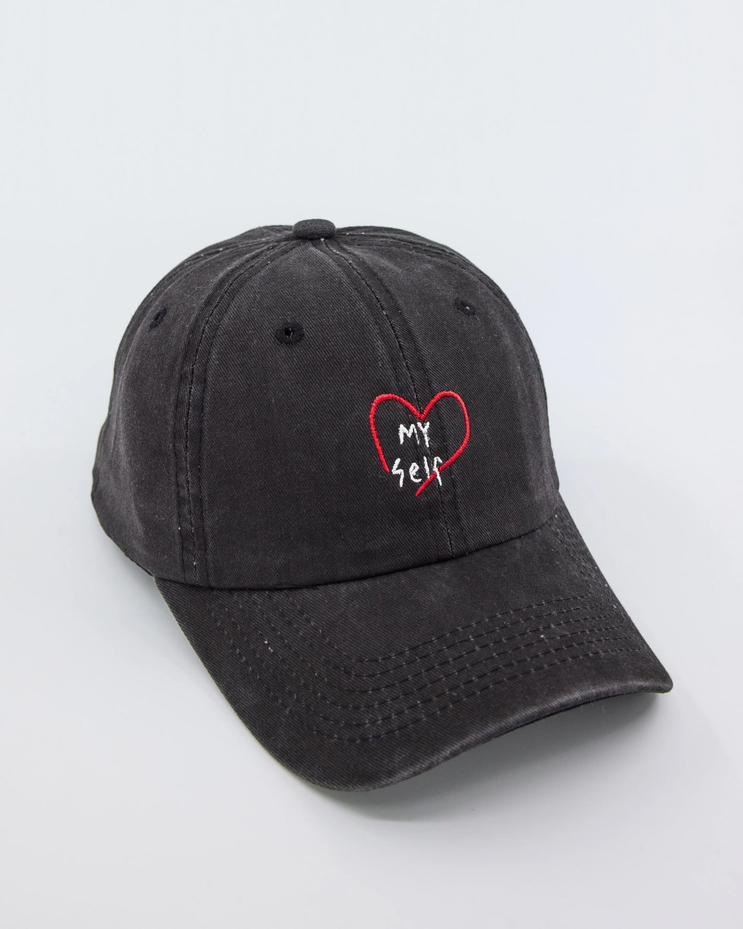 side view of Love Myself Black Washed Cap