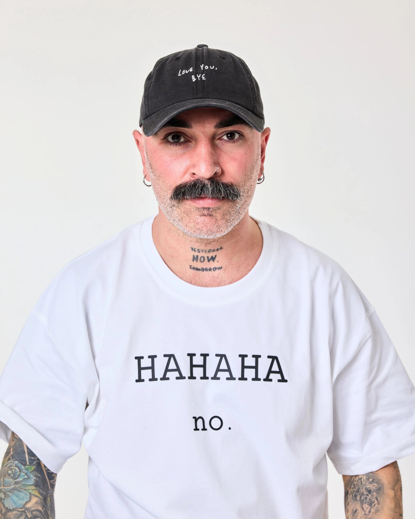 man wearing Love You Bye Black Washed Cap