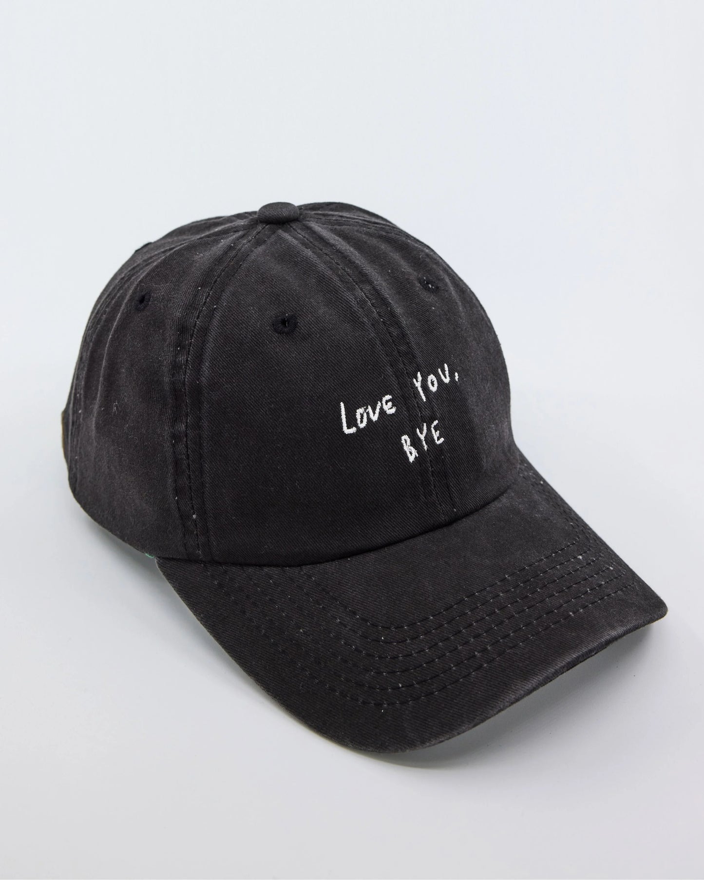 side view of Love You Bye Black Washed Cap