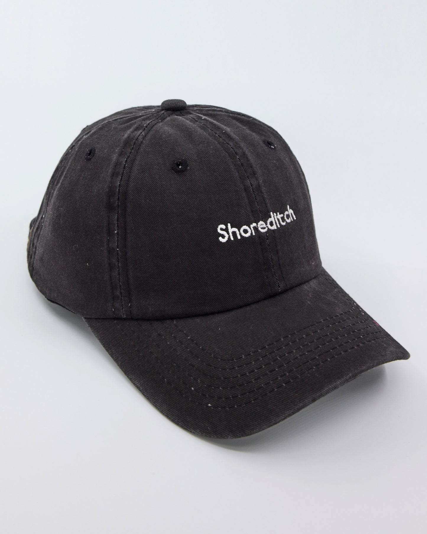 side view of Shoreditch Black Washed Cap
