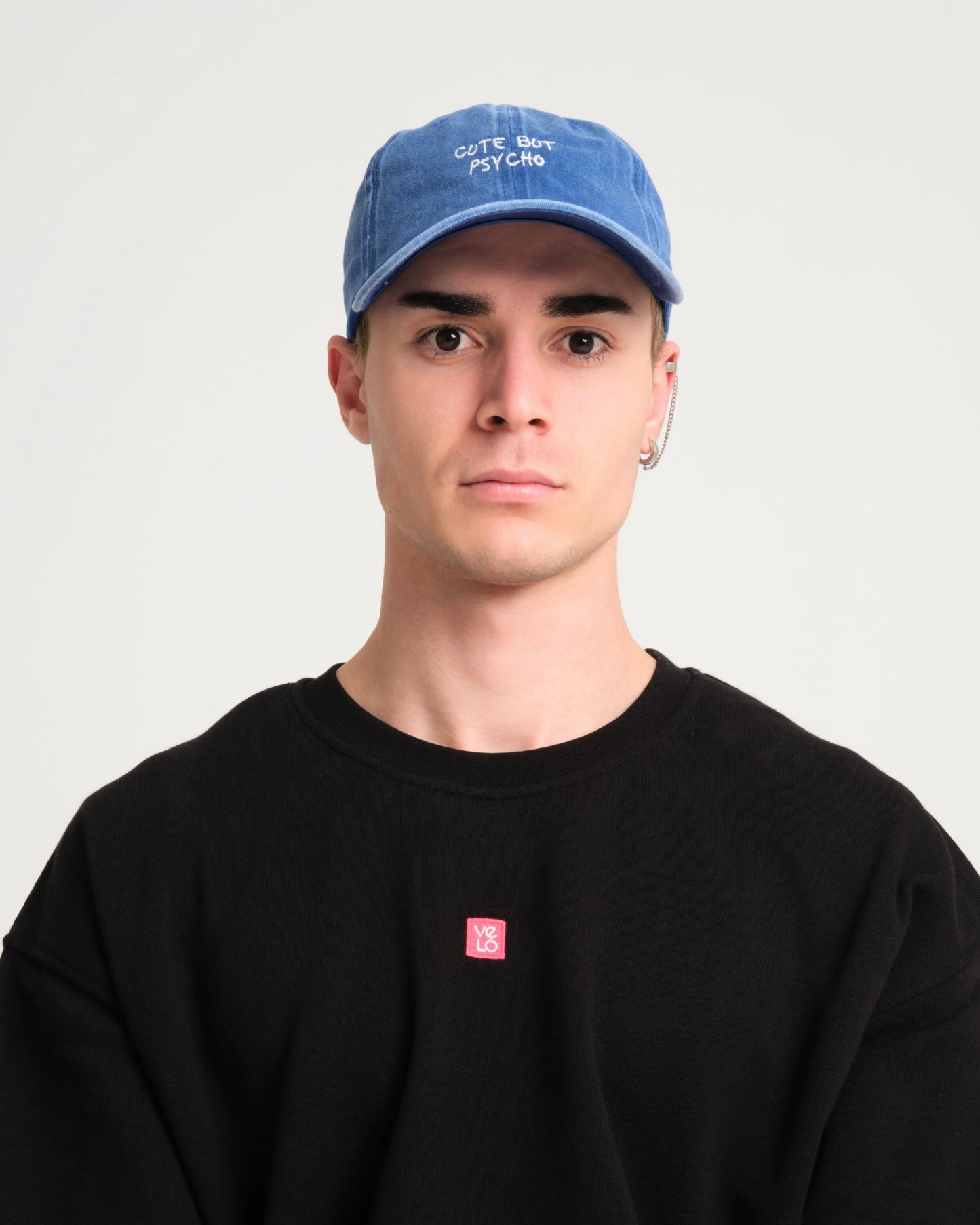 man wearing Cute But Psycho Blue Washed Cap Hat