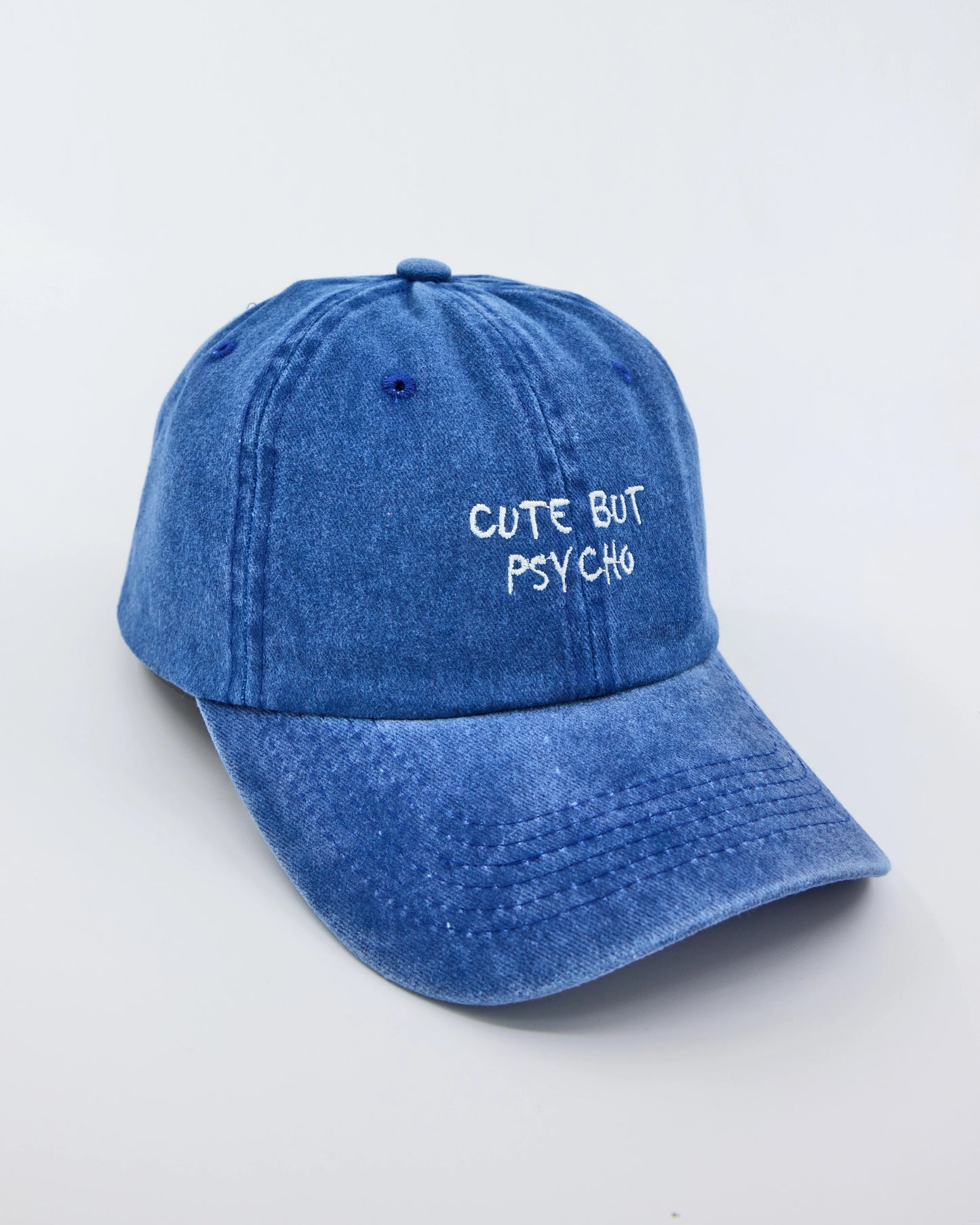 side view of Cute But Psycho Blue Washed Cap