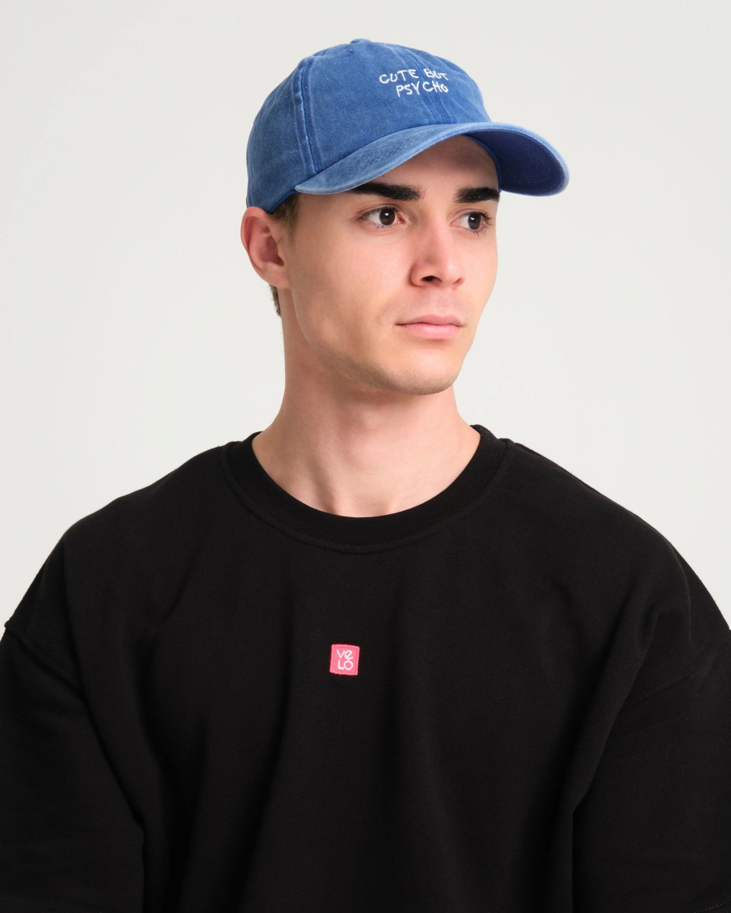 man wearing Cute But Psycho Blue Washed Cap