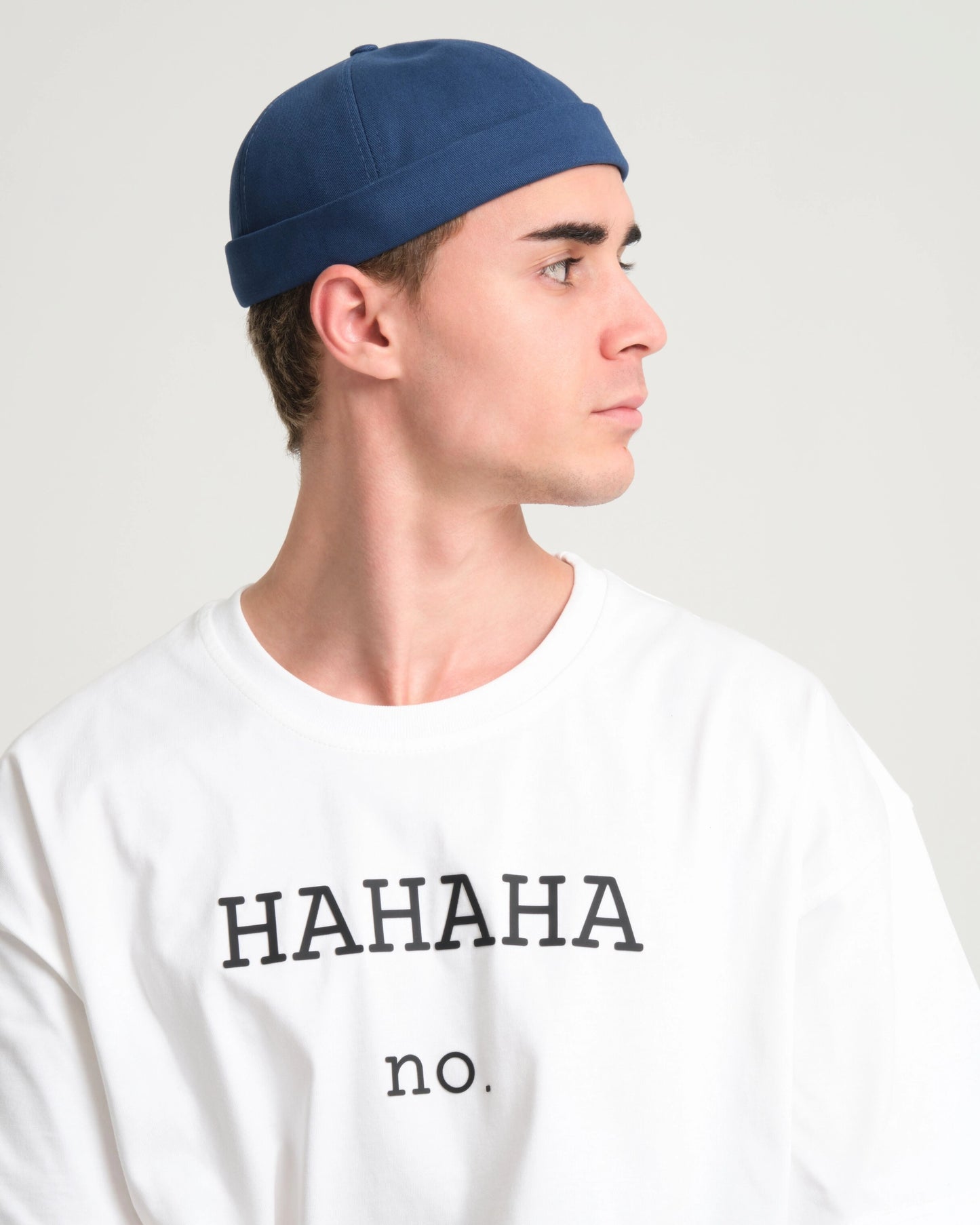 man wearing blue docker cap hat