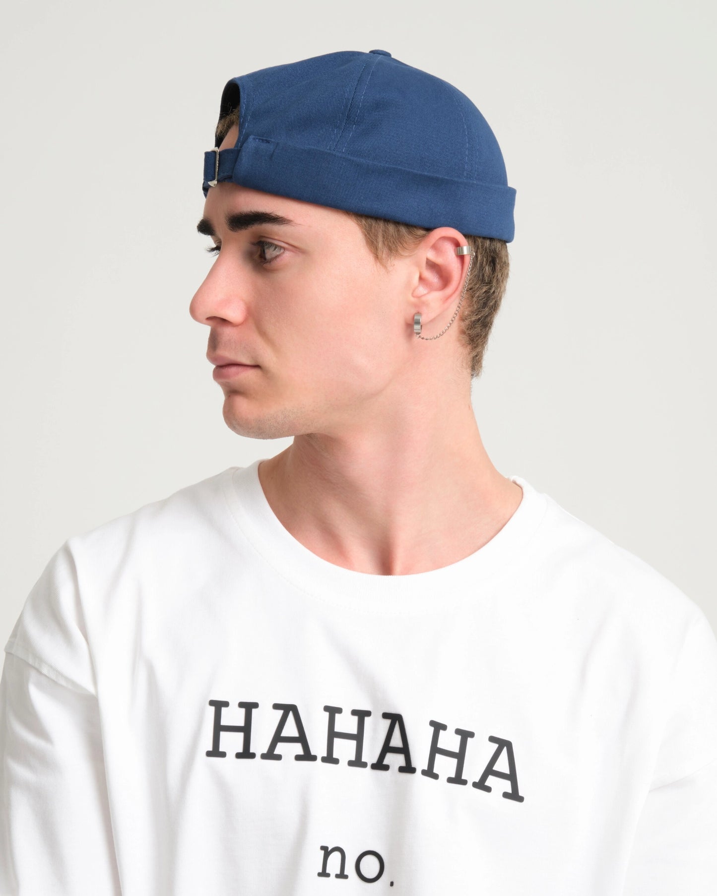man wearing blue docker cap