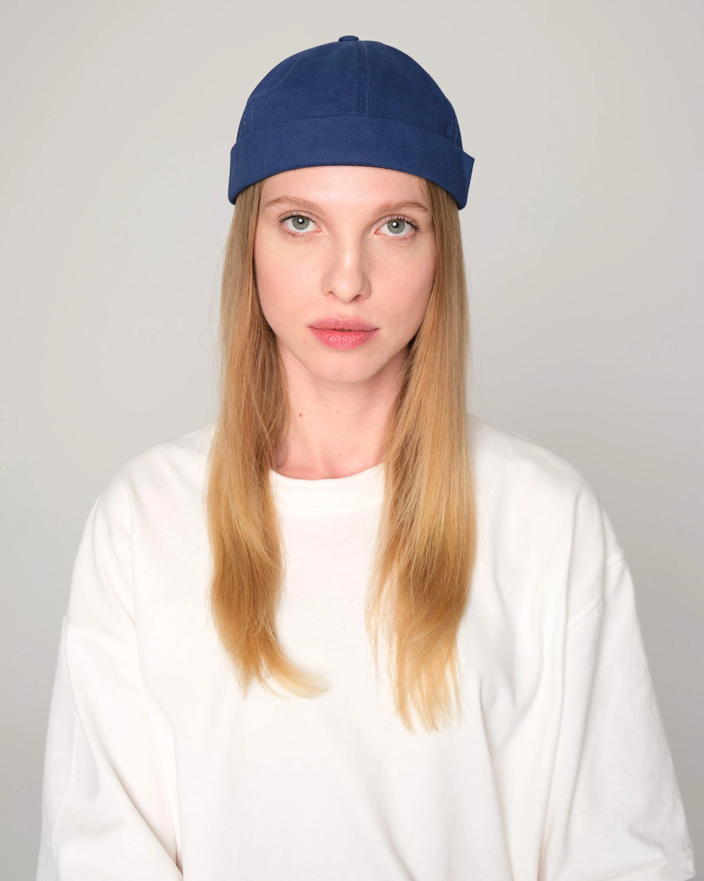 women wearing blue docker cap