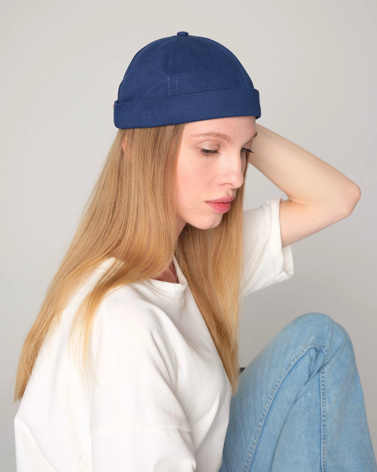 women wearing blue docker cap hat