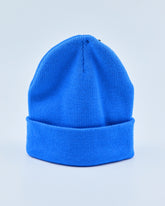 Bright blue beanie on a light gray background