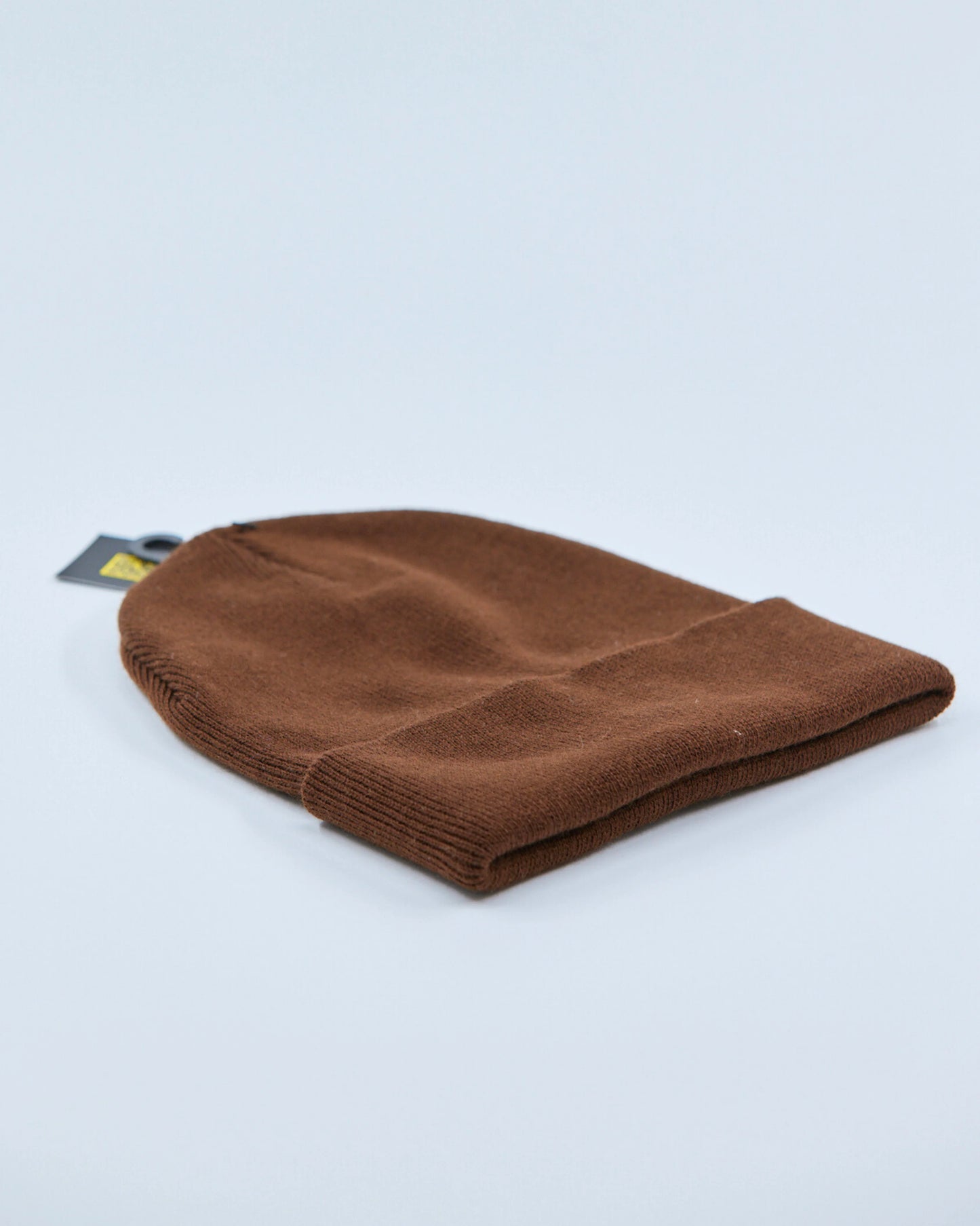 Brown beanie on a light gray background