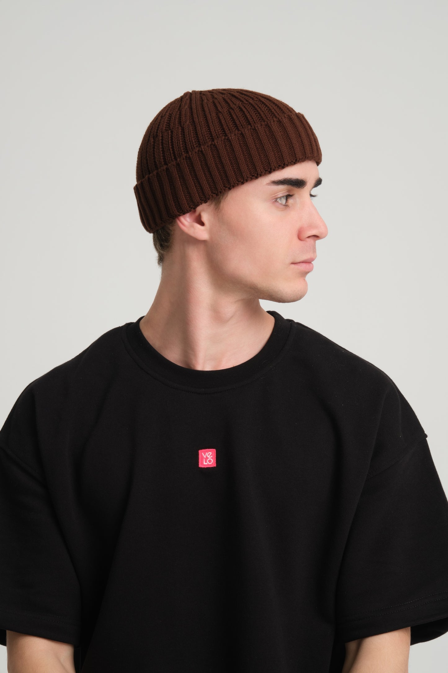 side view of a man wearing Brown Fisherman Beanie
