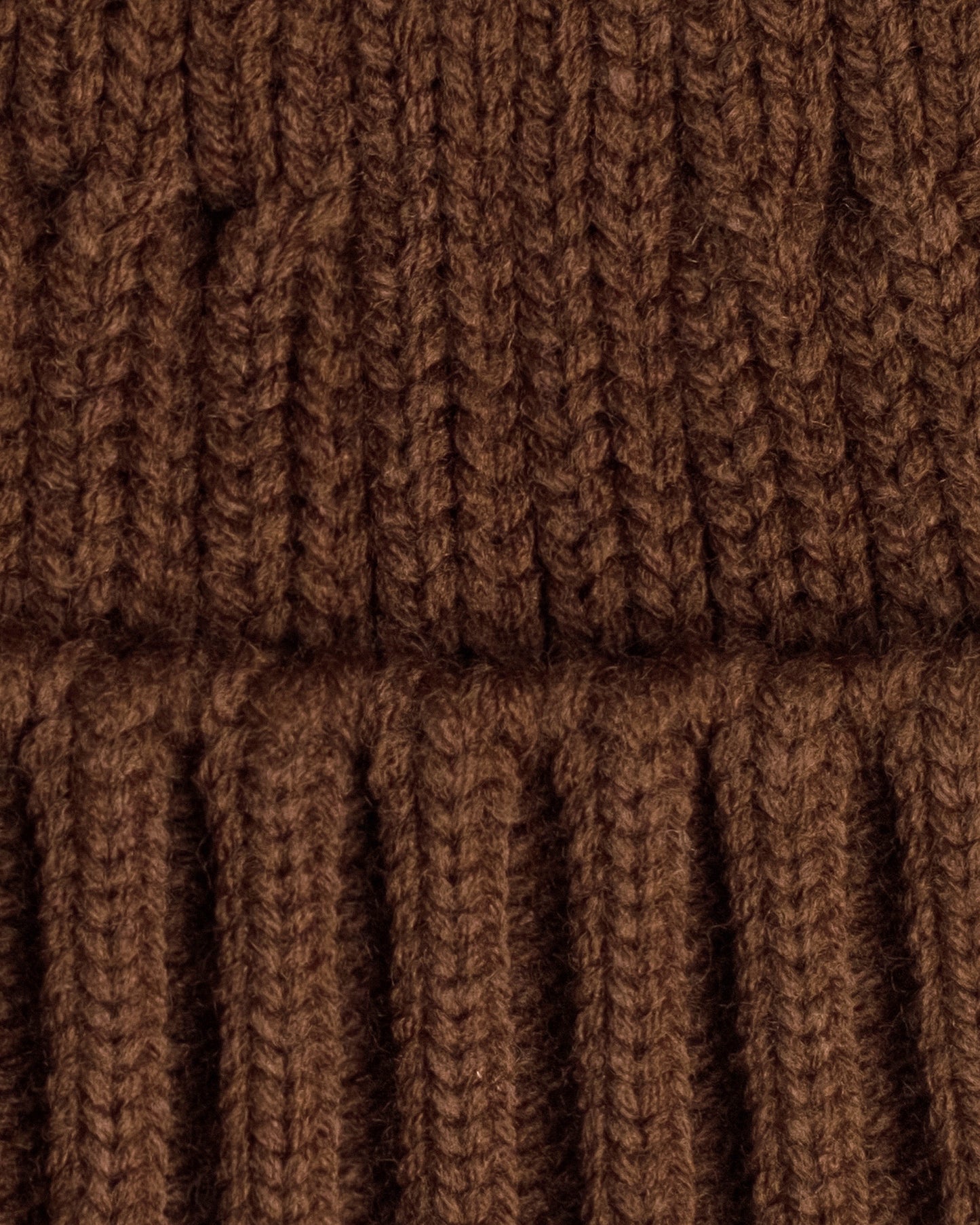 close detail of brown fisherman beanie
