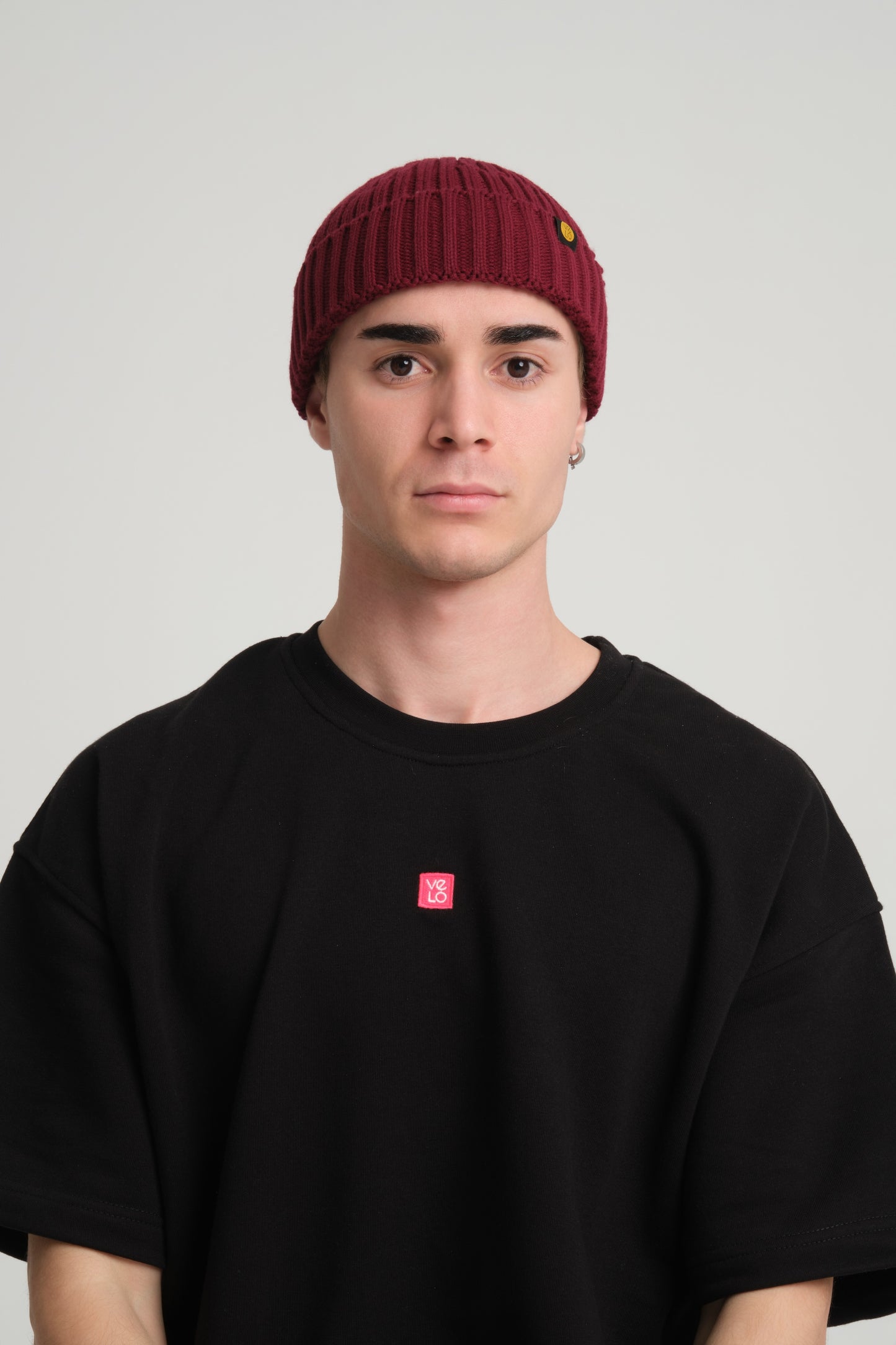 front view of a man wearing Burgundy Fisherman Beanie