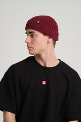 side view of a man wearing Burgundy Fisherman Beanie