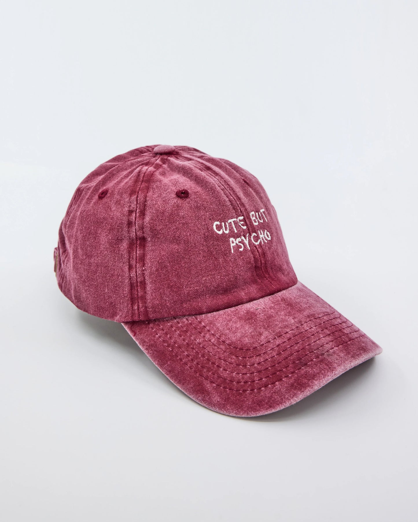 side view of Cute But Psycho Burgundy Washed Caps