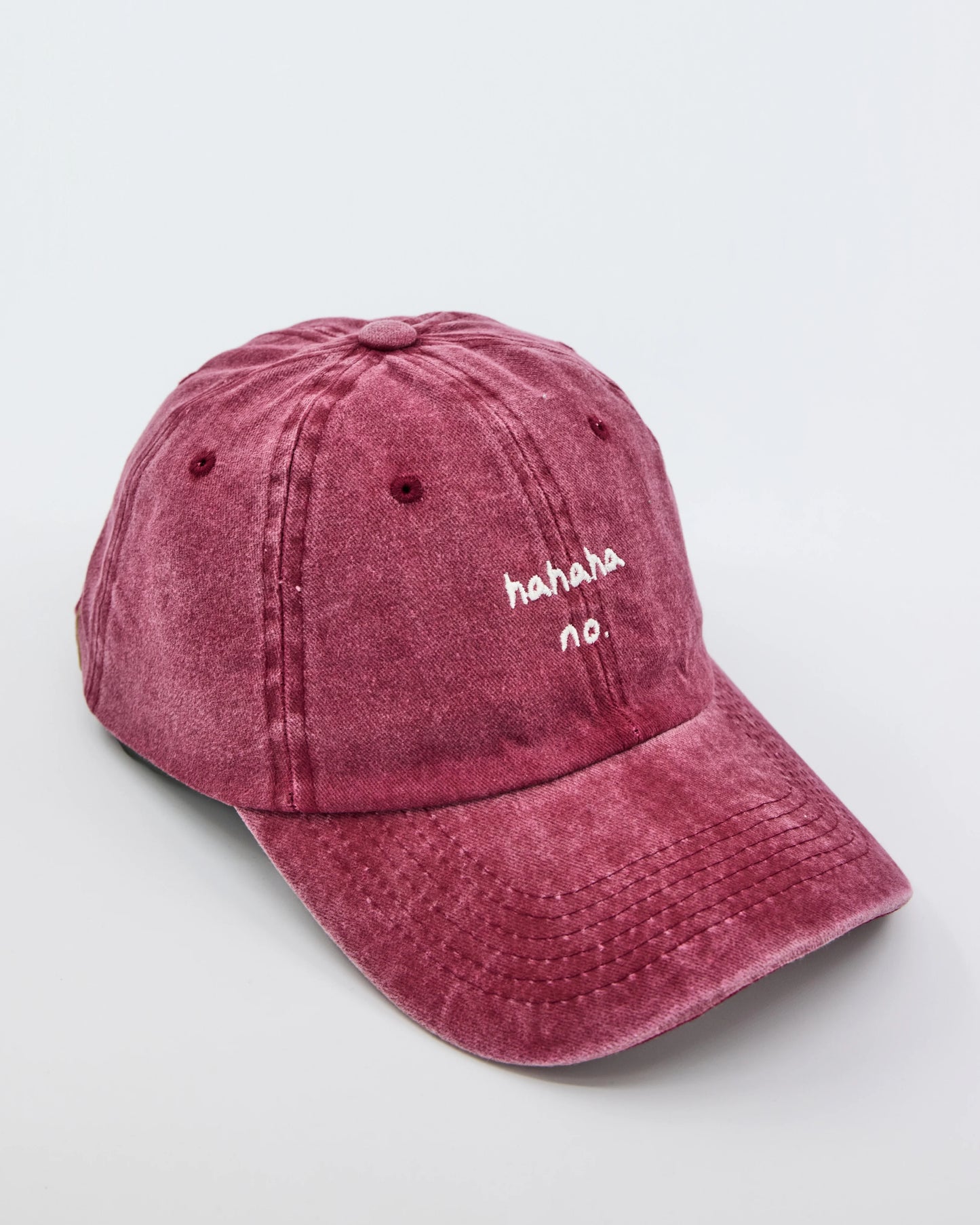 side view of Hahaha No Burgundy Washed Cap