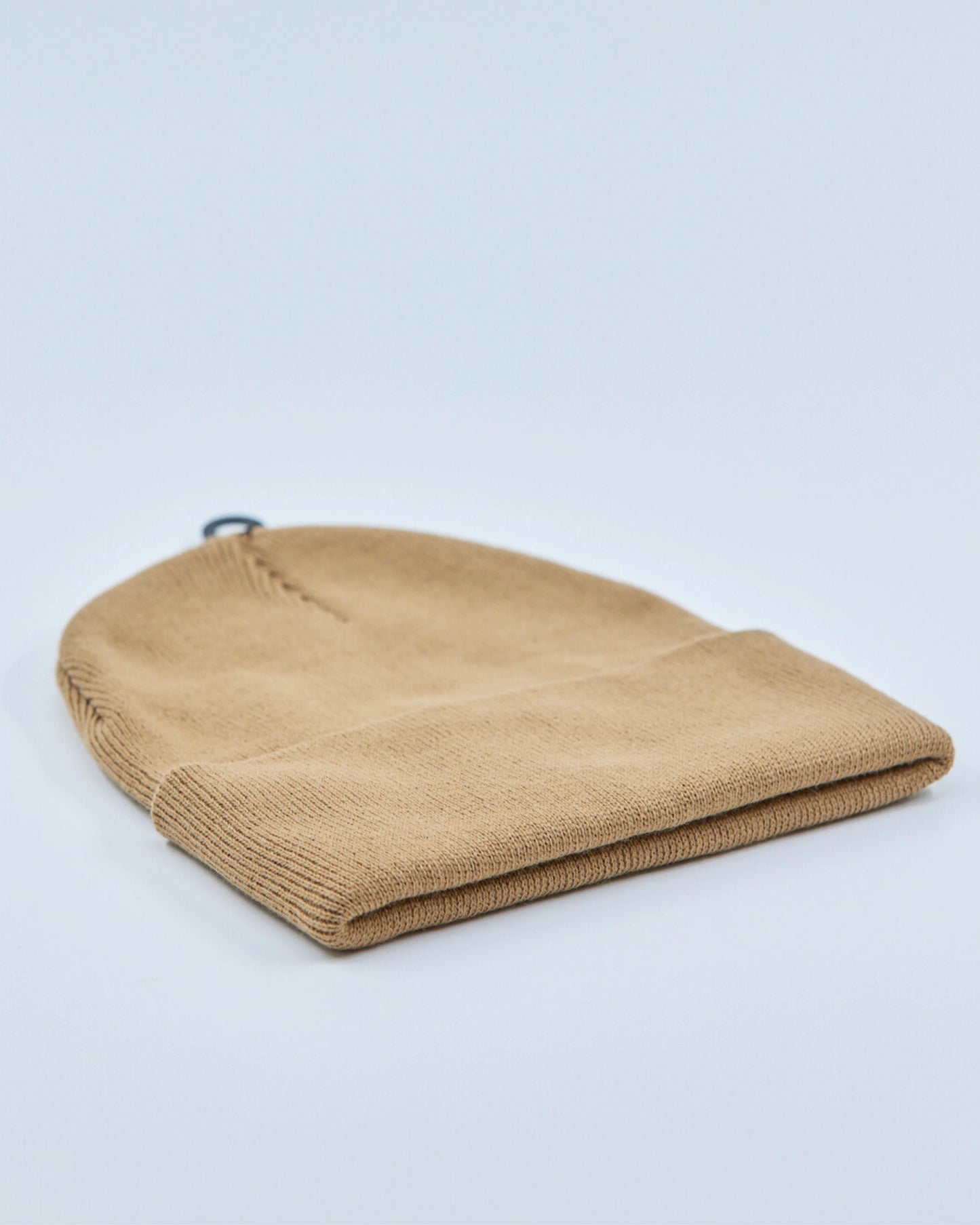 Camel beanie on a light gray background