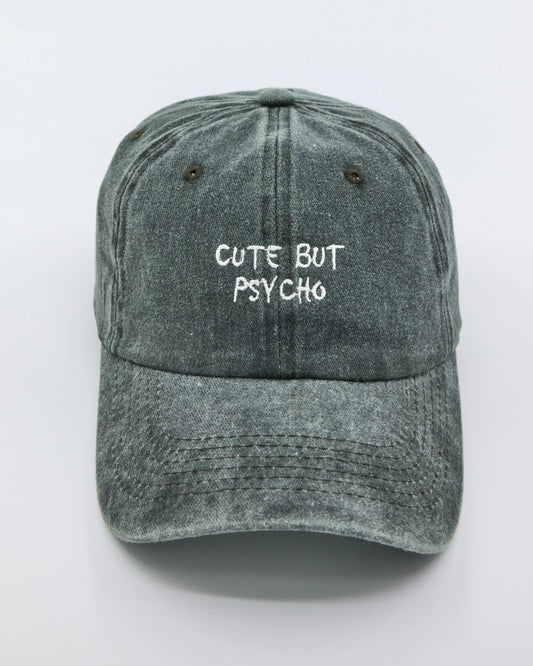 front view of Cute But Psycho Dark Green Washed Cap