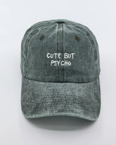 front view of Cute But Psycho Dark Green Washed Cap