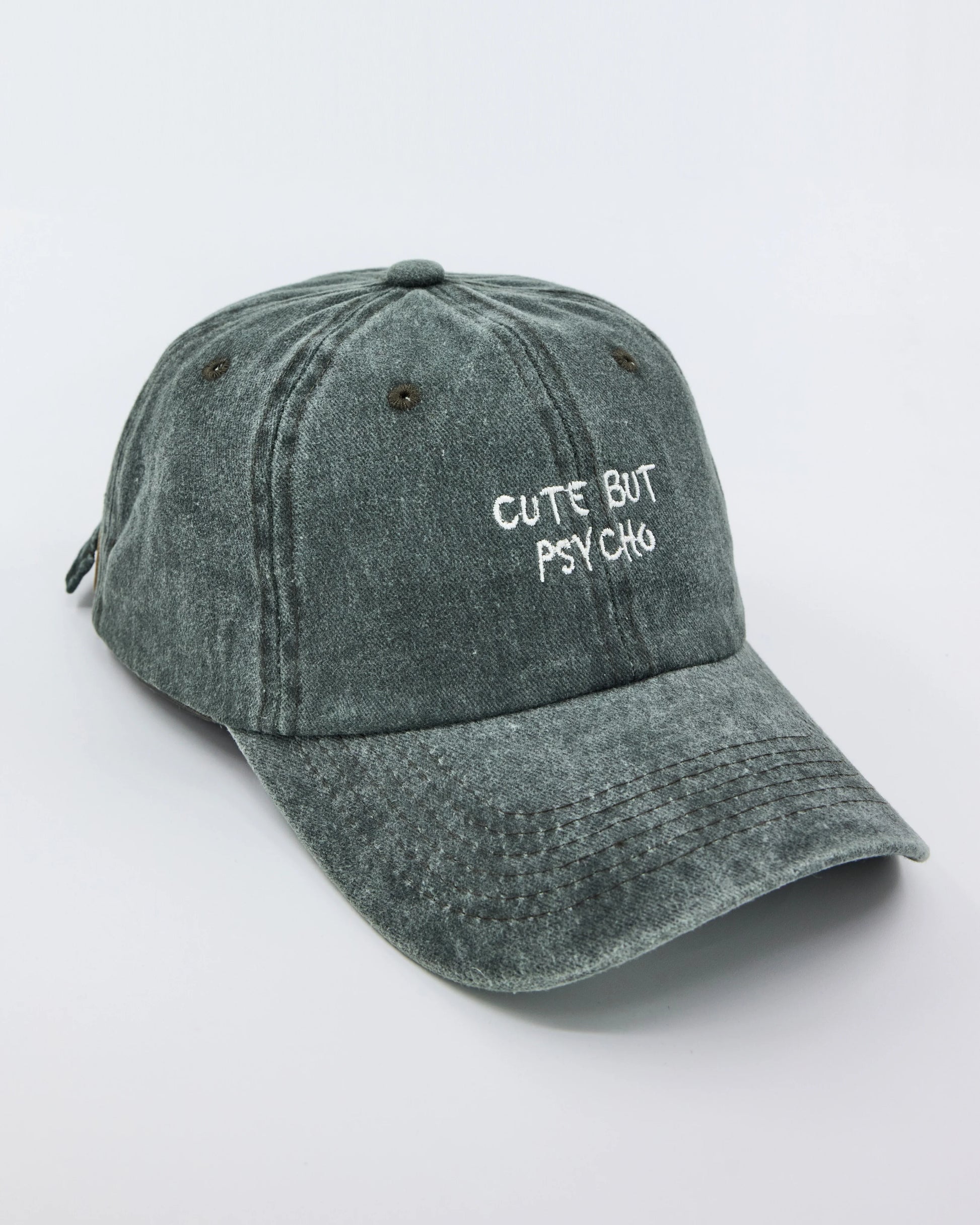 side view of Cute But Psycho Dark Green Washed Cap