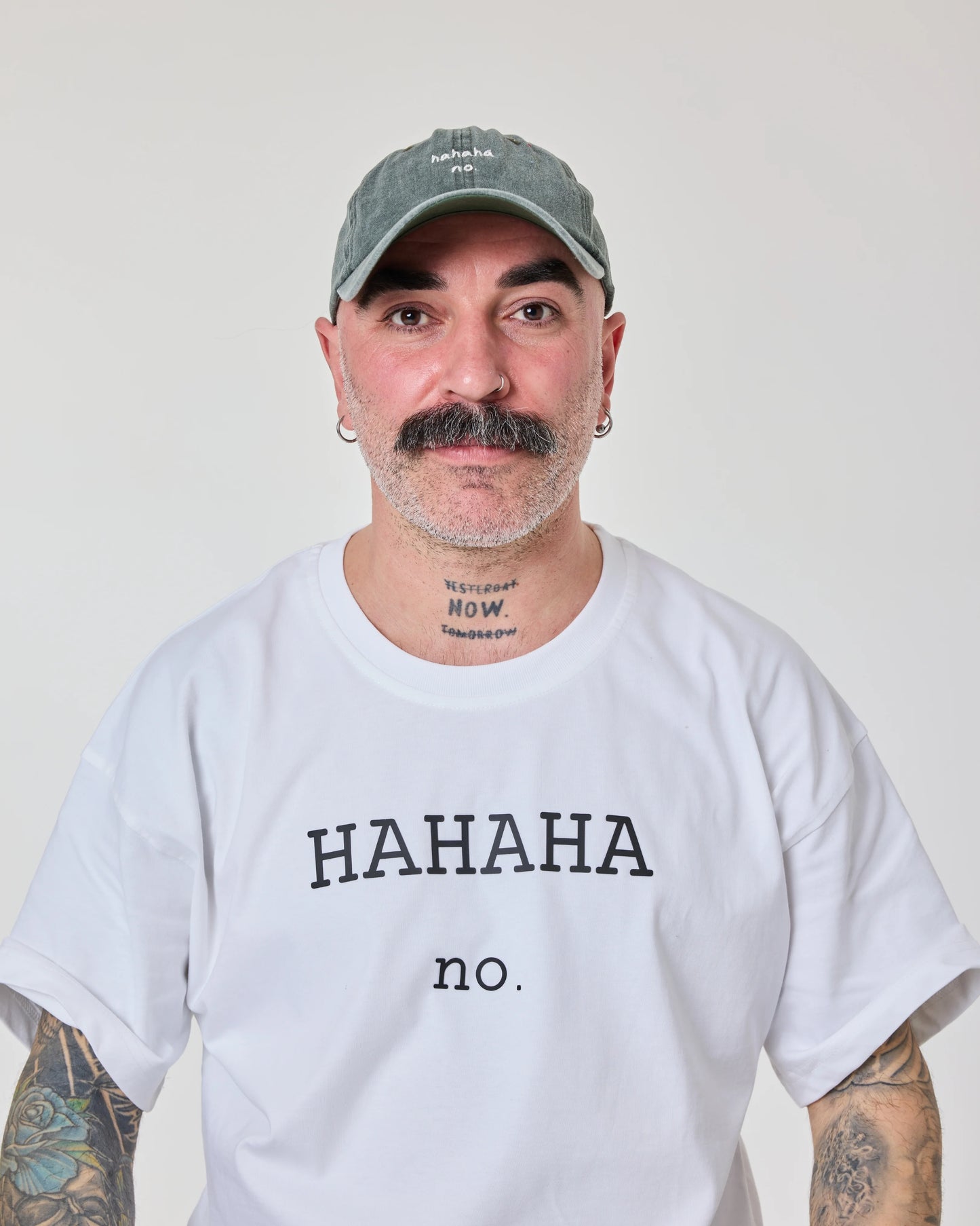 man wearing Hahaha No Dark Green Washed Cap
