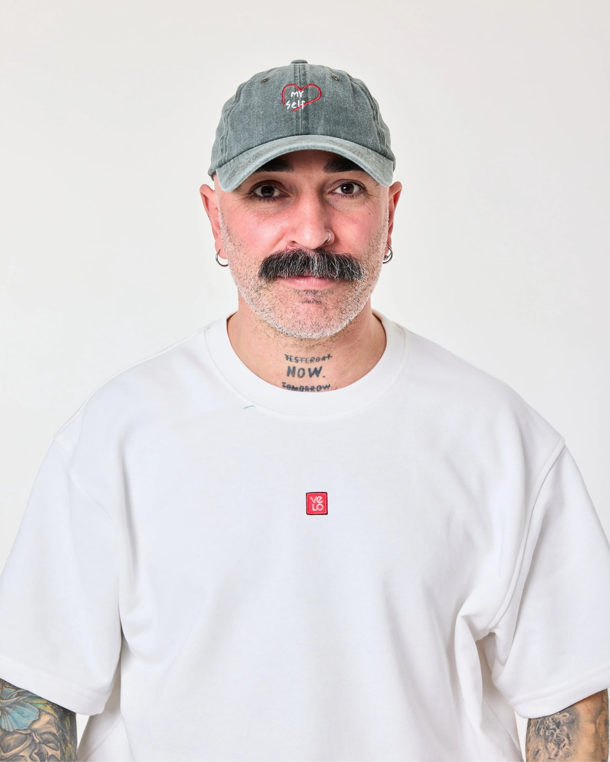 front view of man wearing Love Myself Dark Green Washed Cap