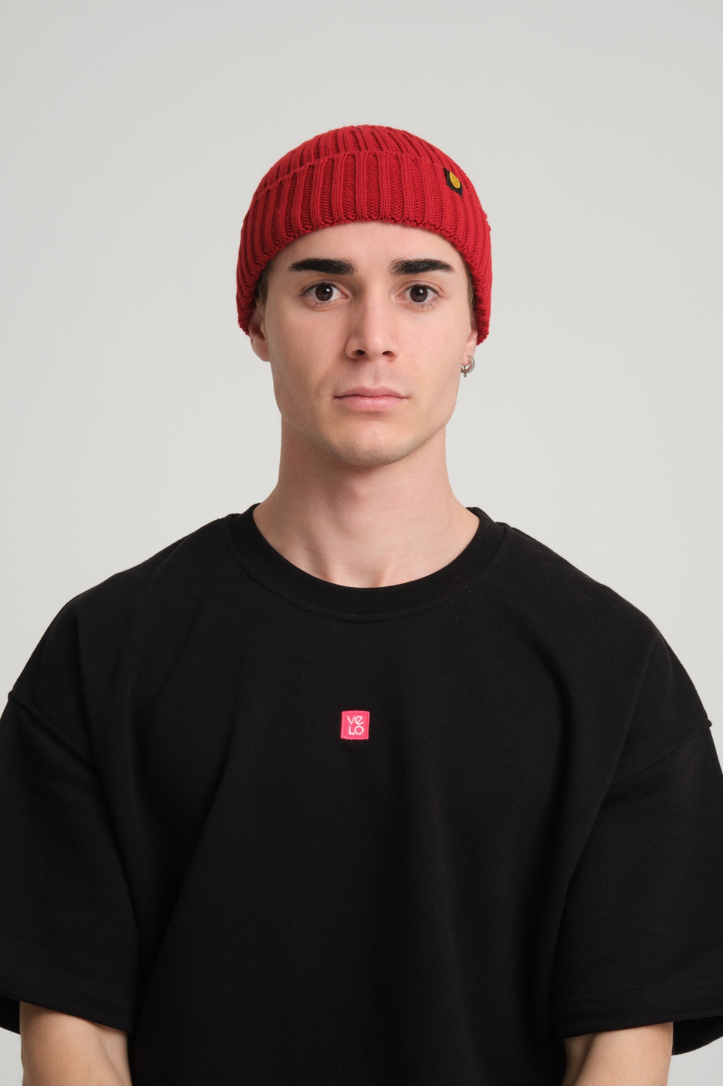 front view of a man wearing Chilli Red Fisherman Beanie