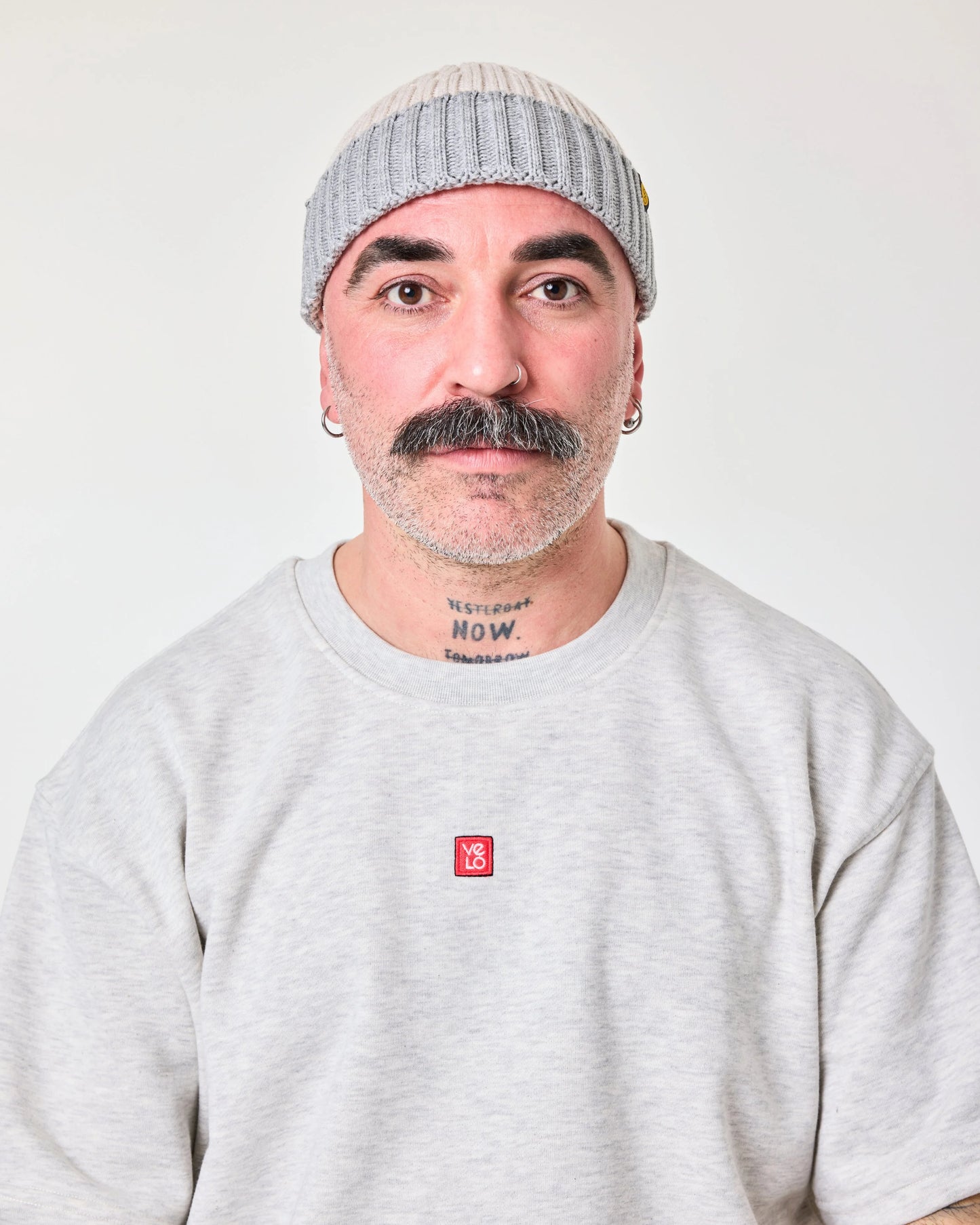 front view of a man wearing Crochet Pattern Cream Fisherman Beanie