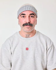 front view of a man wearing Crochet Pattern Cream Fisherman Beanie