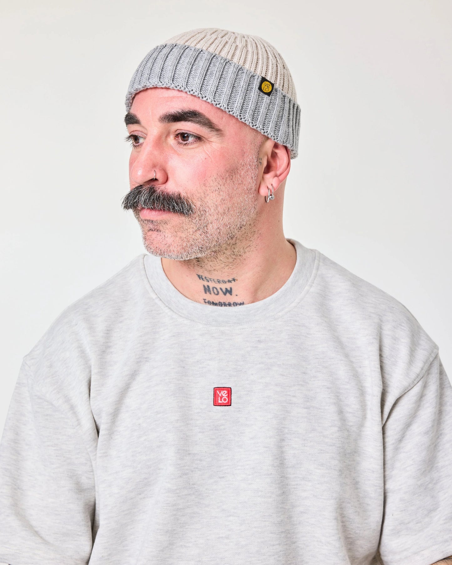 side view of a man wearing Crochet Pattern Cream Fisherman Beanie