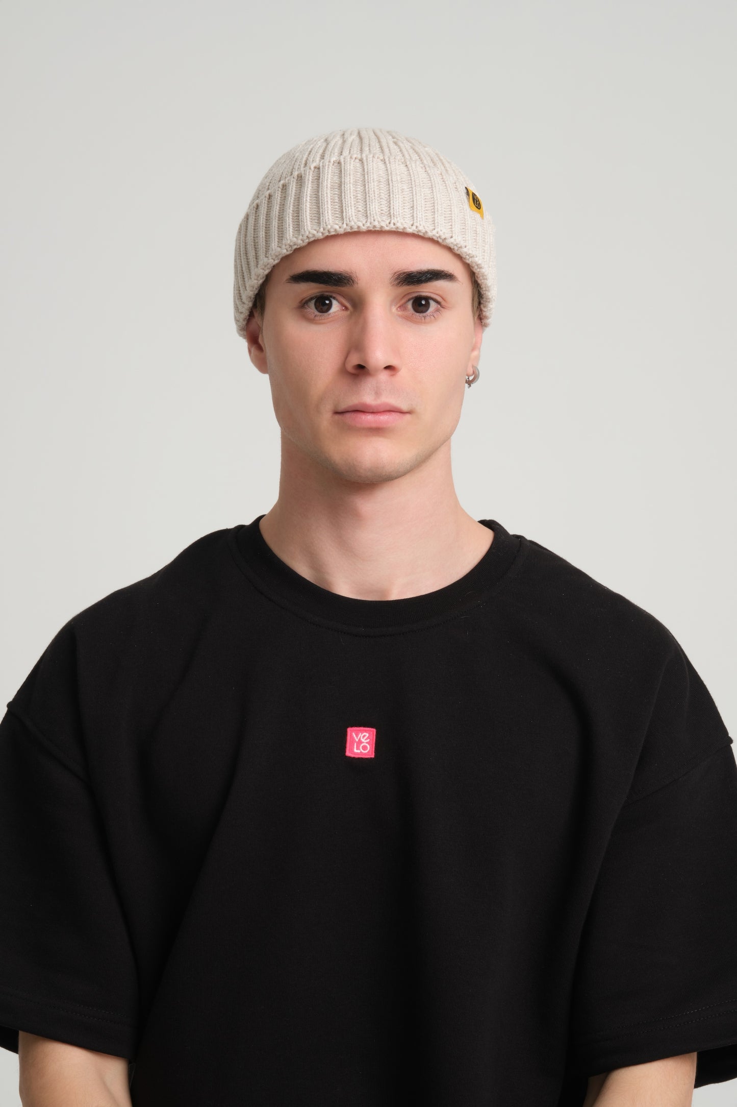front view of a man wearing Cream Fisherman Beanie