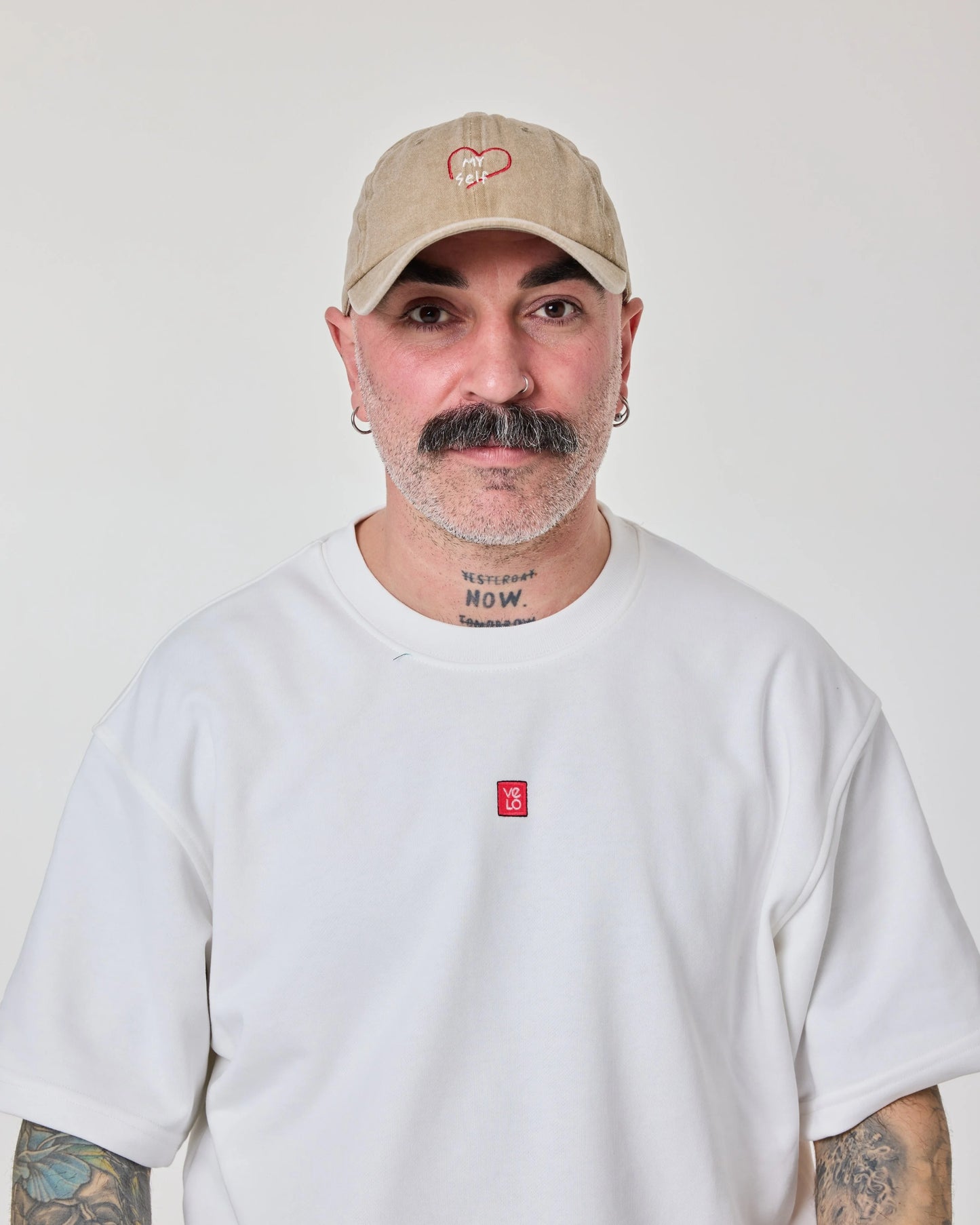 man wearing Love Myself Cream Washed Cap