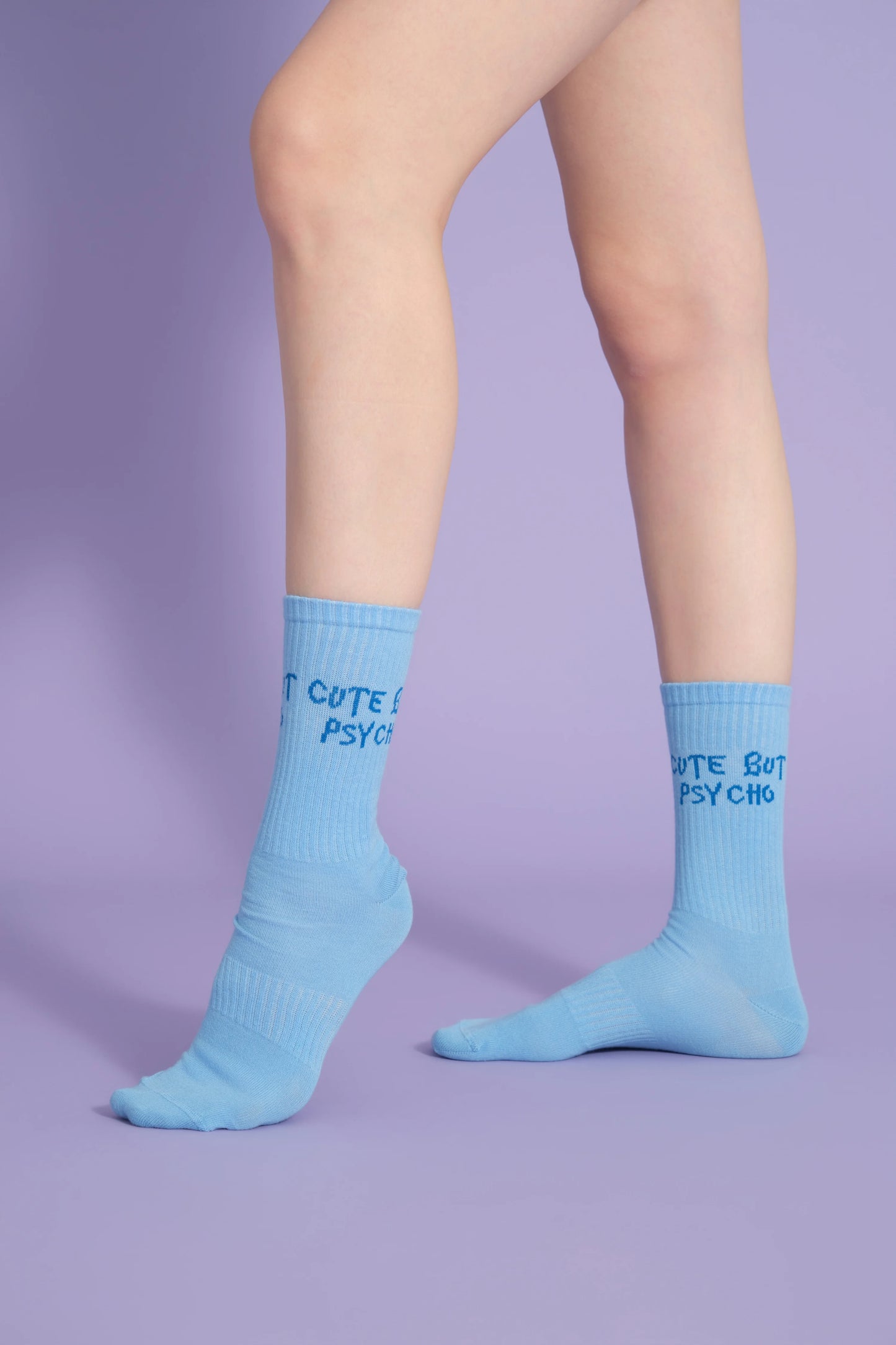 side view of blue cute but psycho socks