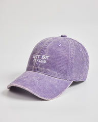 Purple cap with 'Cute But Psycho' text on a light gray background