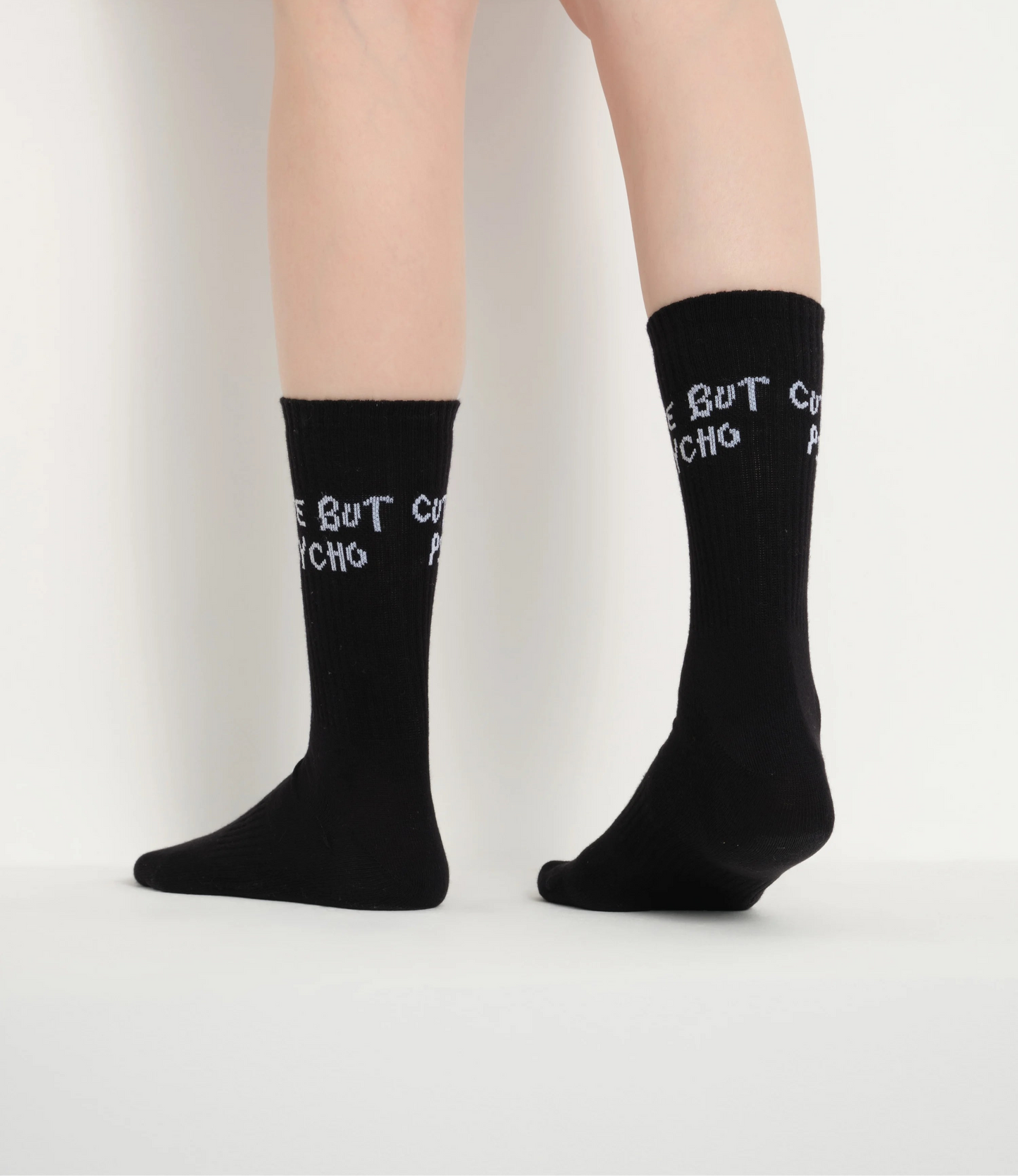 side view of black cute but psycho socks