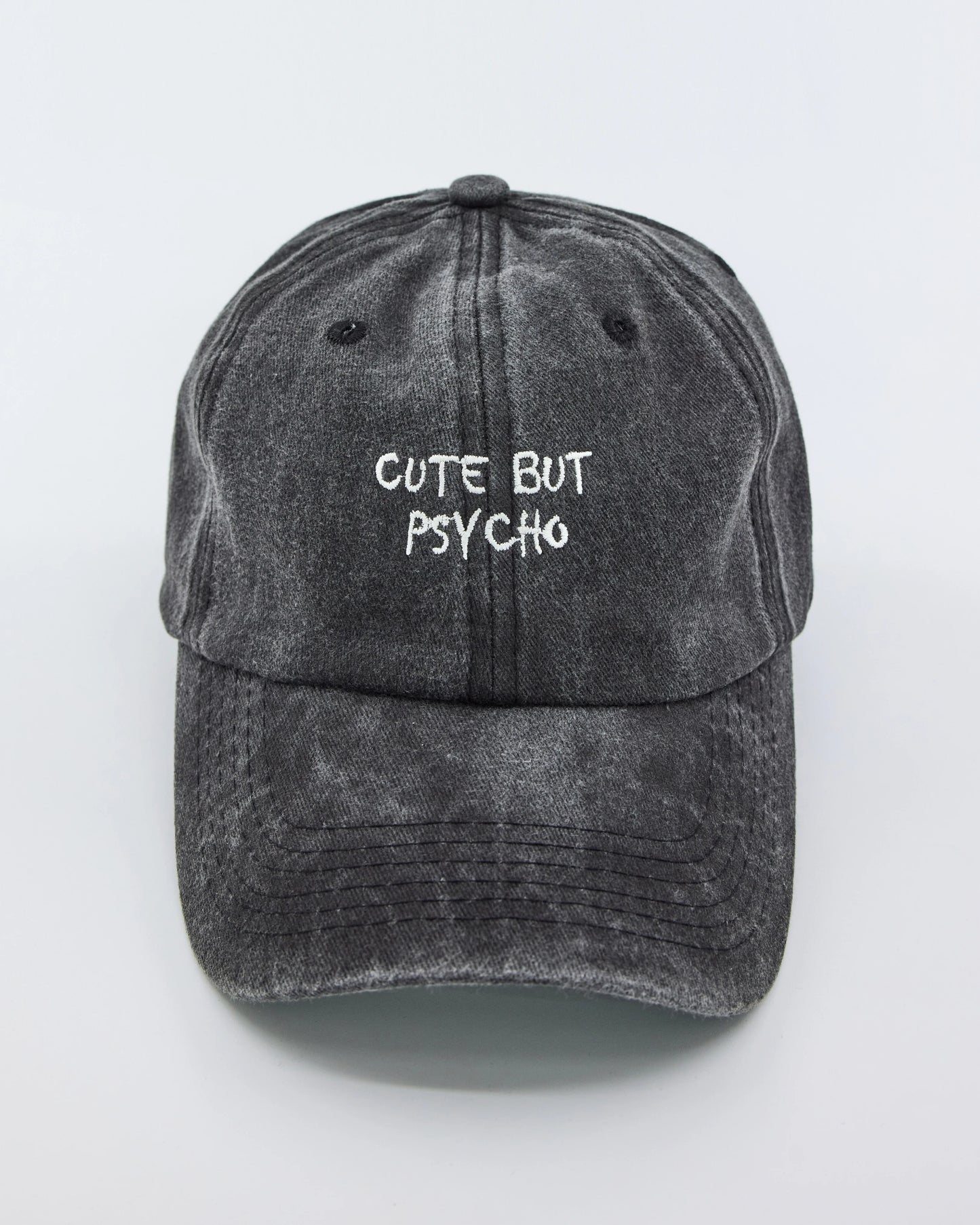 front view of Cute But Psycho Dark Gray Washed Cap