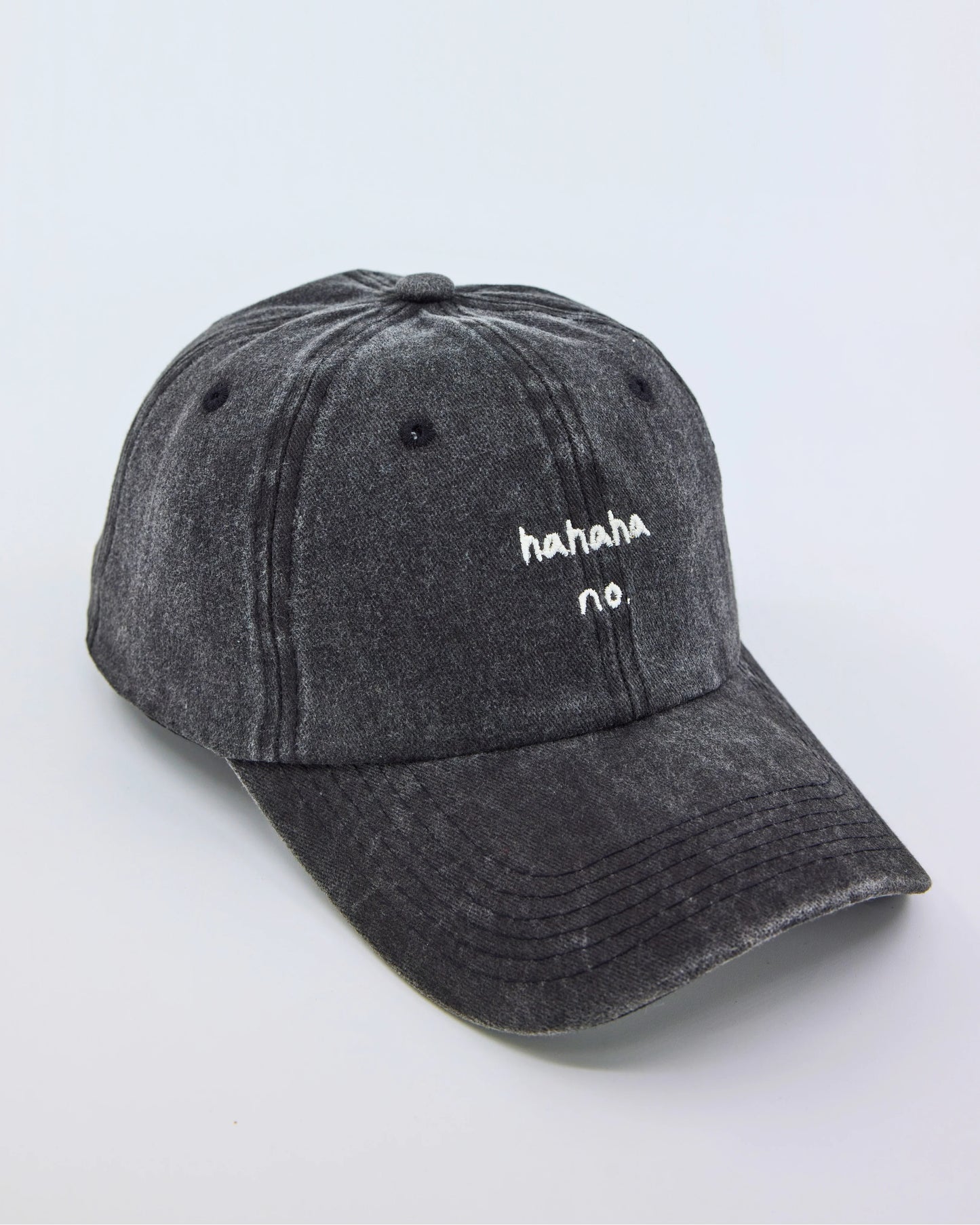 side view of Hahaha No Dark Gray Washed Cap