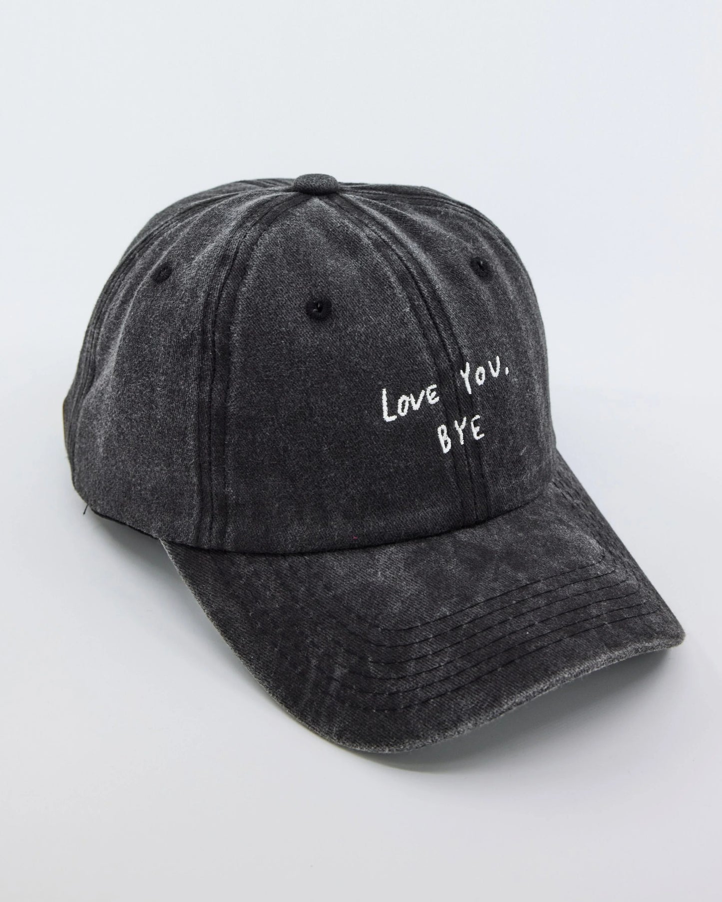 side view of Dark Gray Washed Cap with Love You Bye embroidered in white